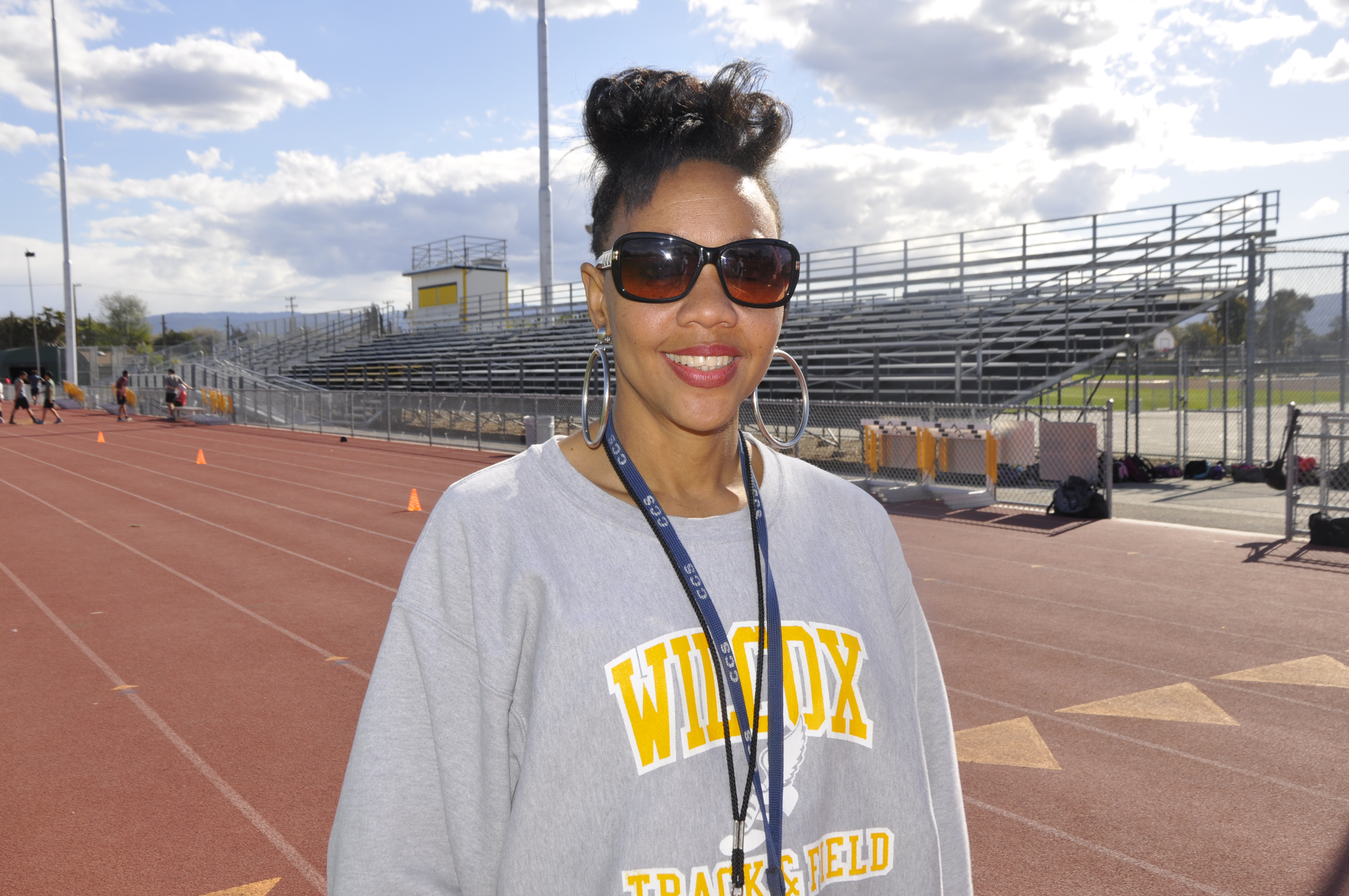 Cancer-stricken Wilcox track coach has former NFL player in her corner