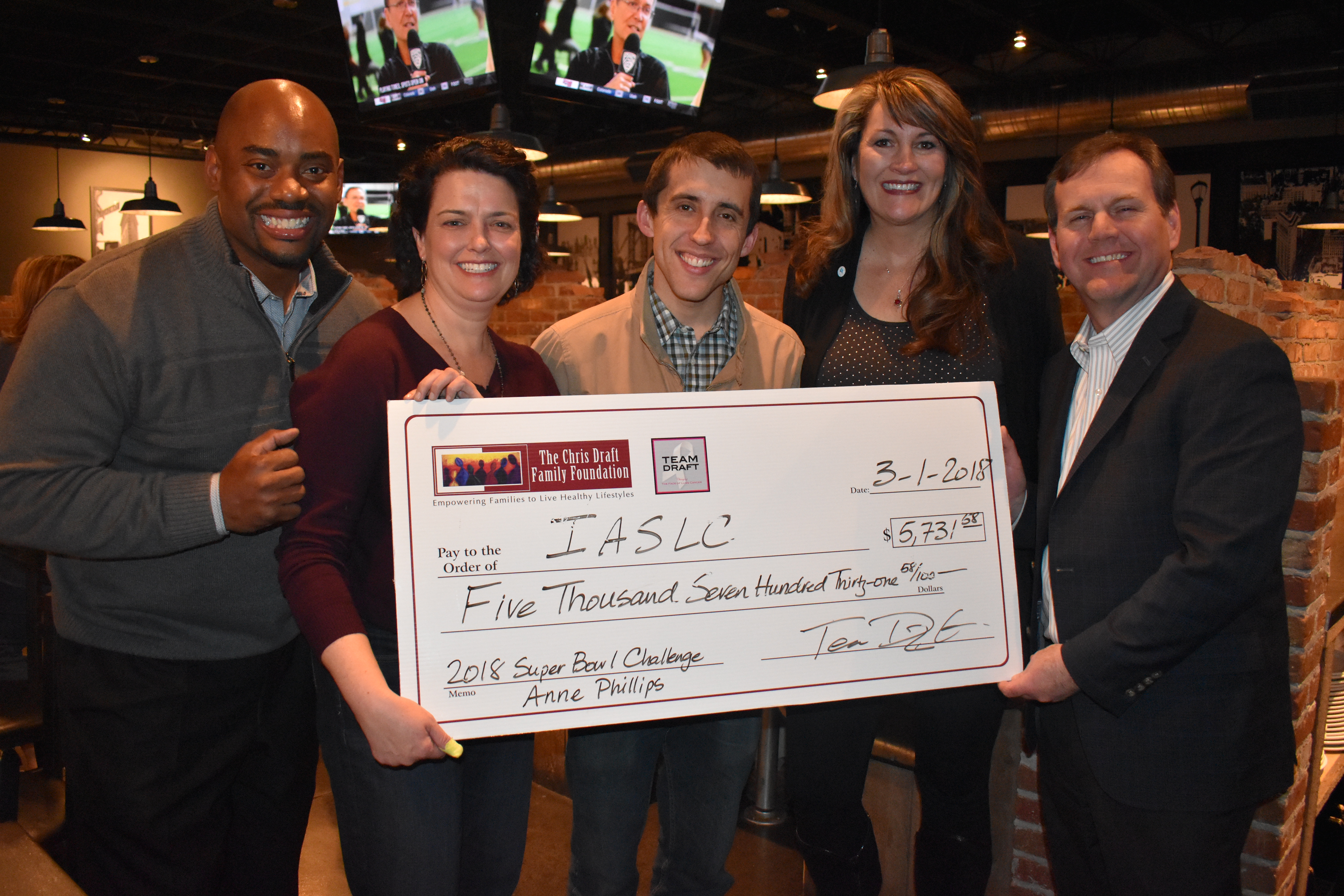 Anne & Ryan Phillips Presented a Check to the IASLC 