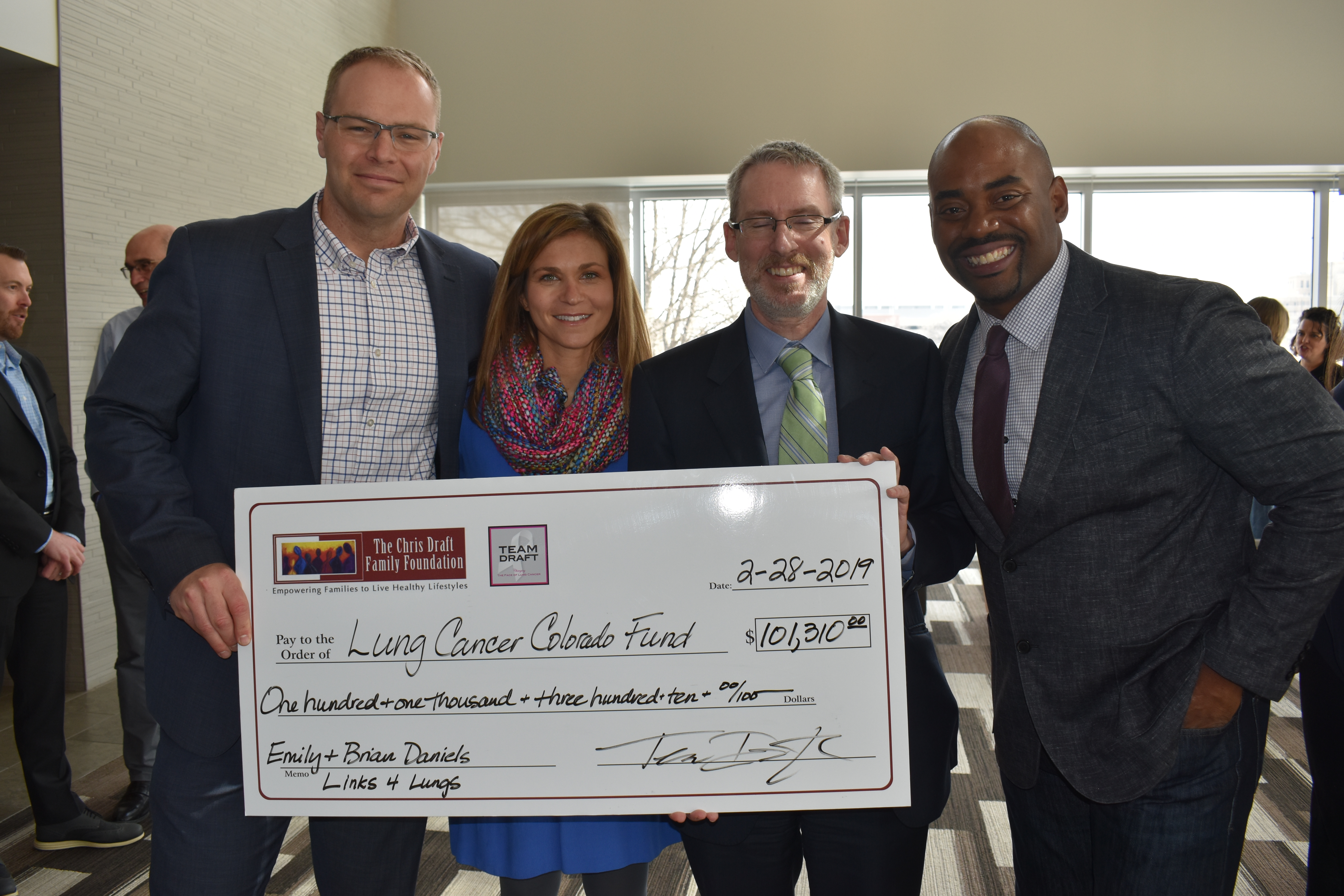 Emily and Brian Daniels Check Presentation to CU Cancer Center #Links4Lungs